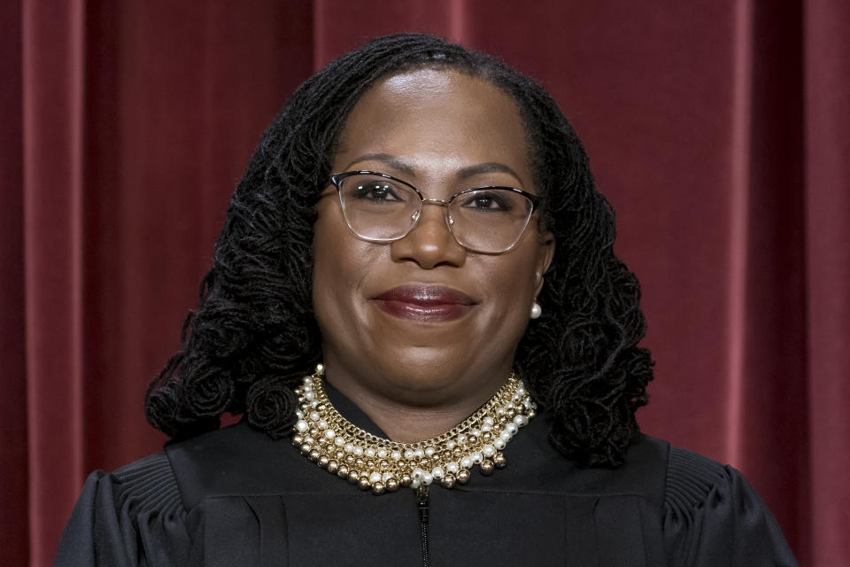FILE - Associate Justice Ketanji Brown Jackson stands as she and members of the Supreme Court pose for a new group portrait following her addition, at the Supreme Court building in Washington, Oct. 7, 2022. (AP Photo/J. Scott Applewhite, File)