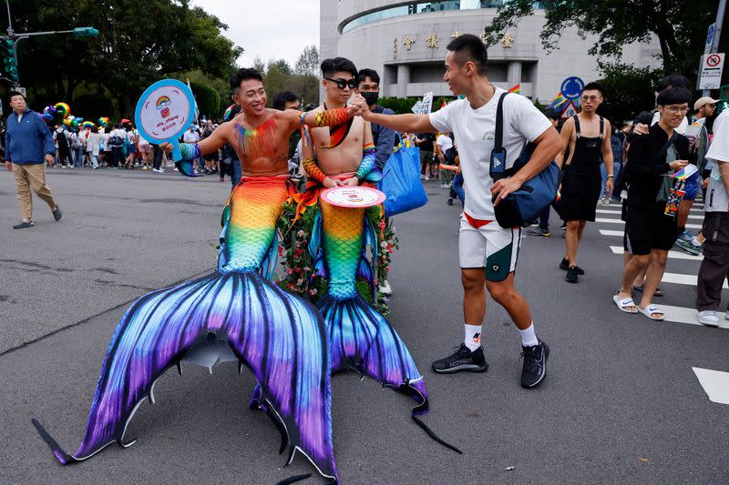 FILE PHOTO: Friends greet each other at the annual Taiwan's Pride parade in Taipei