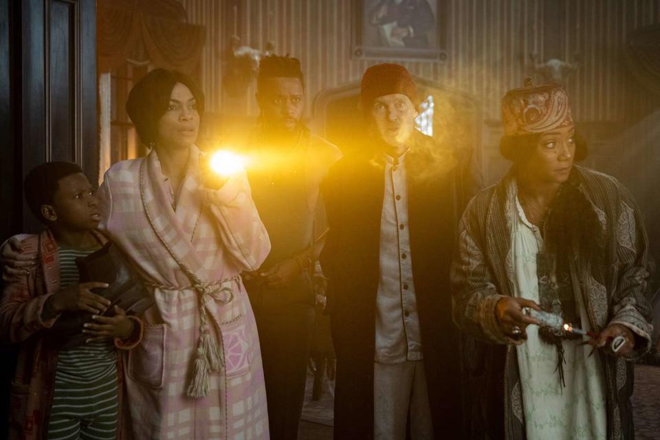 <p>Jalen Marlowe/Disney Enterprises, Inc.</p> Chase Dillon, Rosario Dawson, LaKeith Stanfield, Owen Wilson and Tiffany Haddish in "Haunted Mansion" (2023).