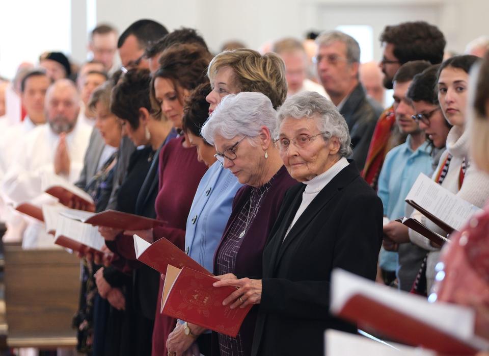 Sister Marita Rother, Blessed Stanley Rother's biological sister, sits with other family members at the Mass for the Dedication of a Church and Altar at the Blessed Stanley Rother Shrine Friday, February 17, 2023