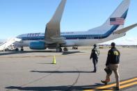 National Transportation Safety Board investigators document information and gather evidence after a campaign plane carrying Republican vice presidential nominee Mike Pence skidded off the runway after landing at New York City's LaGuardia Airport Thursday, in New York City, New York, U.S., October 28, 2016. Peter Knudson/NTSB/Handout via REUTERS