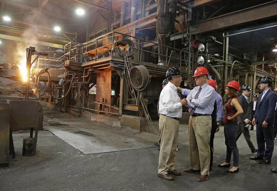 Republican vice presidential candidate, Indiana Gov. Mike Pence, second from left, gets a tour at a Charlotte Pipe and Foundry Company plant in Charlotte, N.C., Wednesday, Aug. 24, 2016.