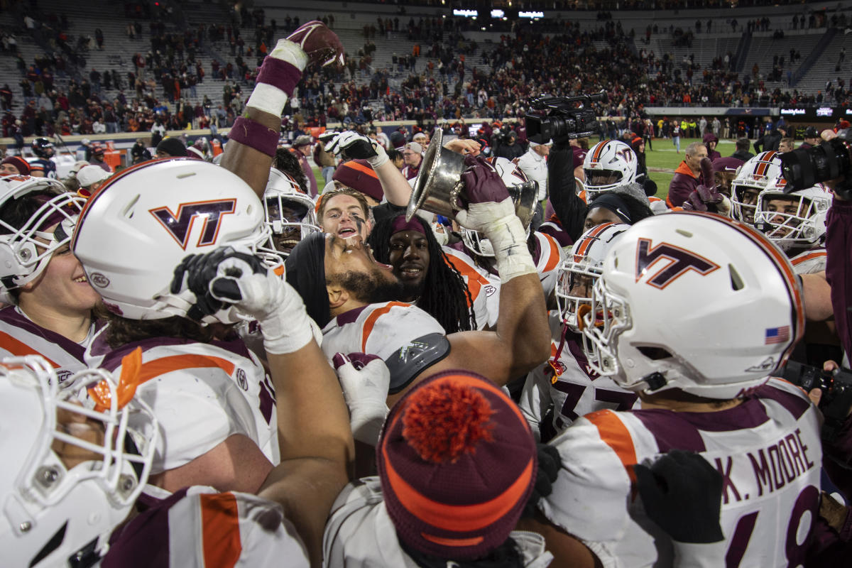 #Virginia Tech wanted to take an on-field photo after a big rivalry win, so Virginia turned the sprinklers on them