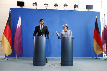 German Chancellor Angela Merkel and Qatar Emir Sheikh Tamim bin Hamad al-Thani attend a news conference in Berlin, Germany, September 15, 2017. REUTERS/Axel Schmidt