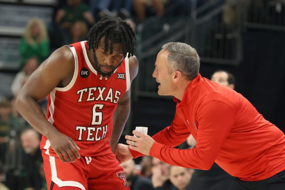 Texas Tech head coach Grant McCasland speaks to Texas Tech guard Joe Toussaint (6) during the Big 12 basketball game, Tuesday, Feb. 6, 2024, in Waco, Texas.