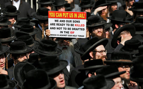 Ultra-Orthodox Jews protest against army recruitment - Credit: EPA