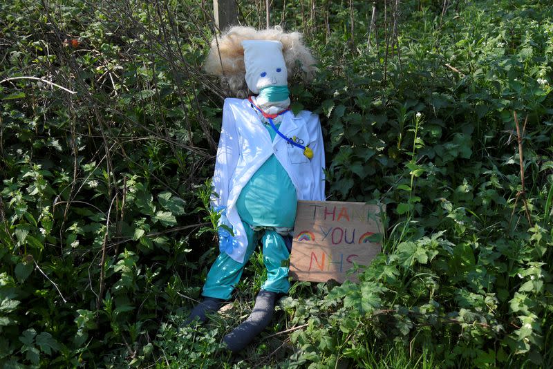 Scarecrows representing key workers lighten the daily lockdown walk, as the number of the coronavirus disease cases (COVID-19) grows around the world, in the village of Capel