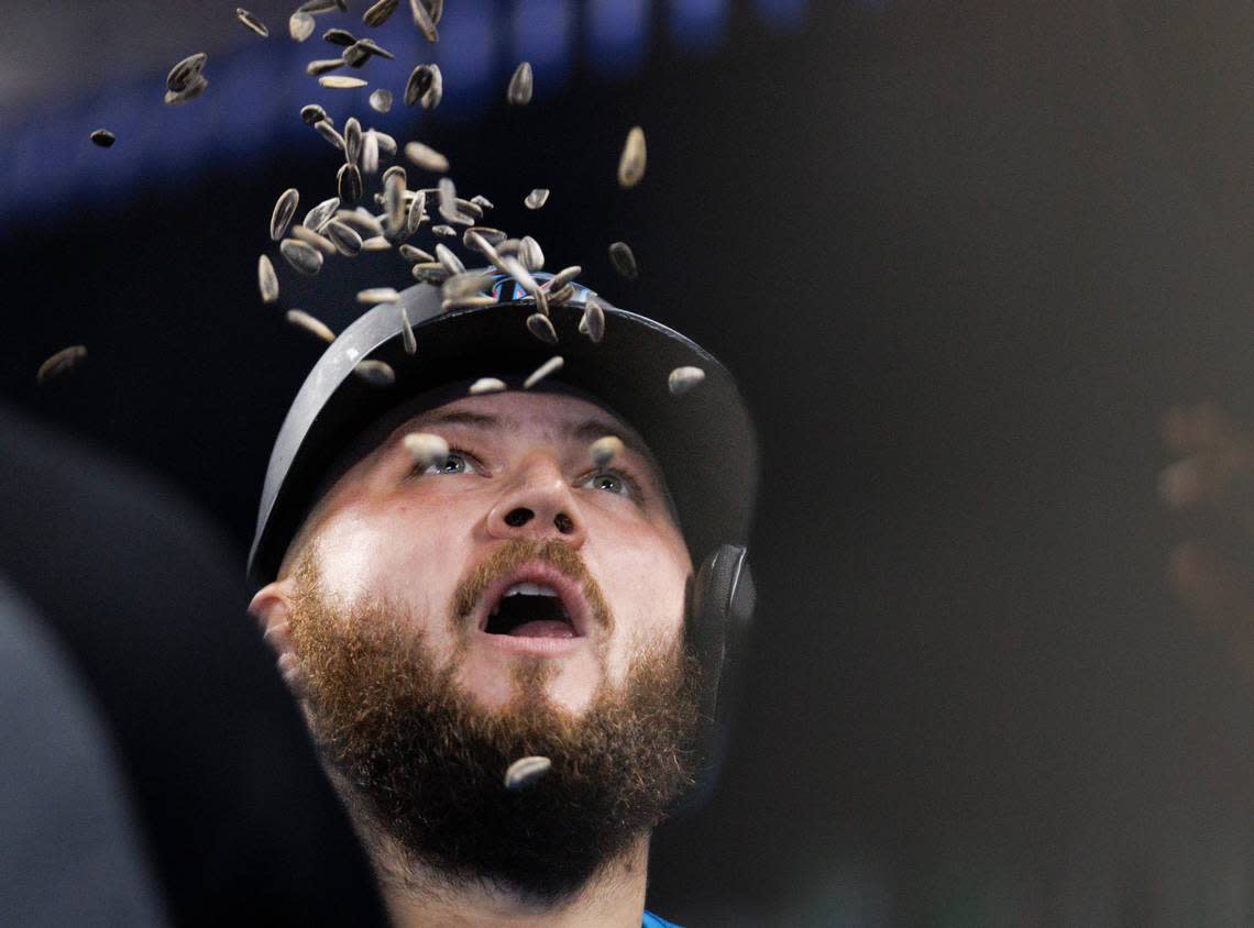 Miami Marlins third baseman Jake Burger (36) celerbates in the dugout after hitting a two run home run during the second inning of a baseball game against the San Diego Padres on Sunday, Aug. 11, 2024, at loanDepot Park in Miami.