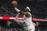 Cleveland Cavaliers guard Caris LeVert shoots in front of Boston Celtics forward Sam Hauser (30) during the first half of Game 3 of an NBA basketball second-round playoff series Saturday, May 11, 2024, in Cleveland. (AP Photo/Sue Ogrocki)