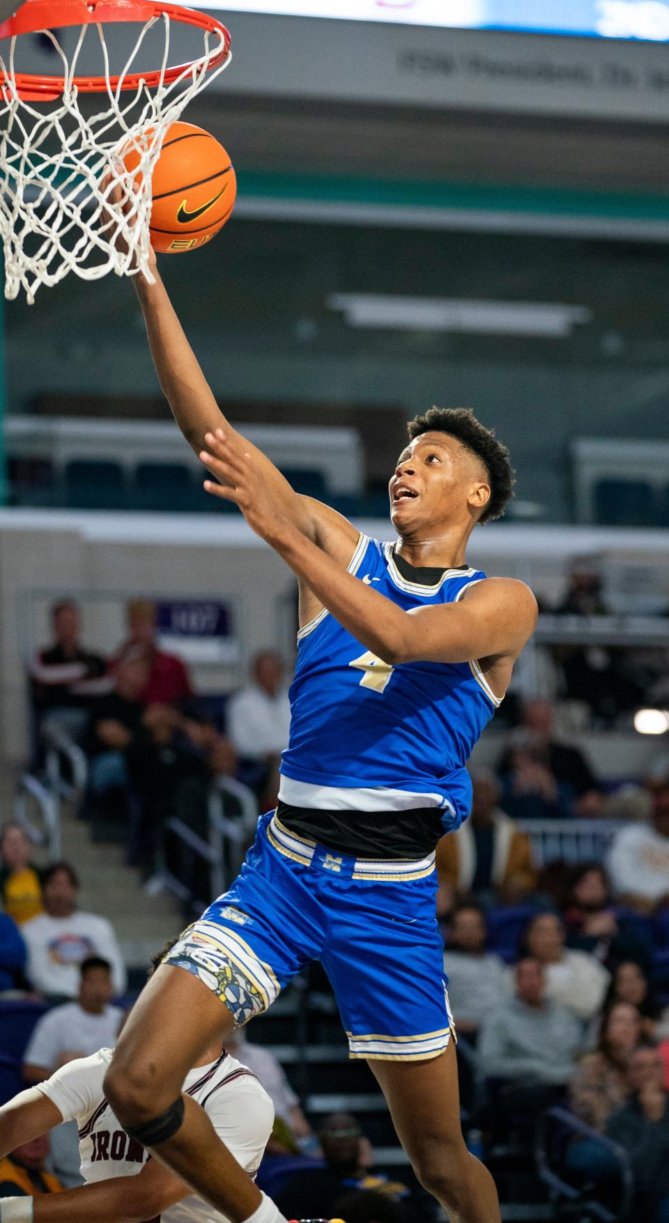 McEachern Indians guard Ace Bailey (4) drives to the basket during the second quarter of a game against the Don Bosco Prep Ironmen during the 50th annual City of Palms Classic at Suncoast Credit Union Arena in Fort Myers on Tuesday, Dec. 19, 2023.