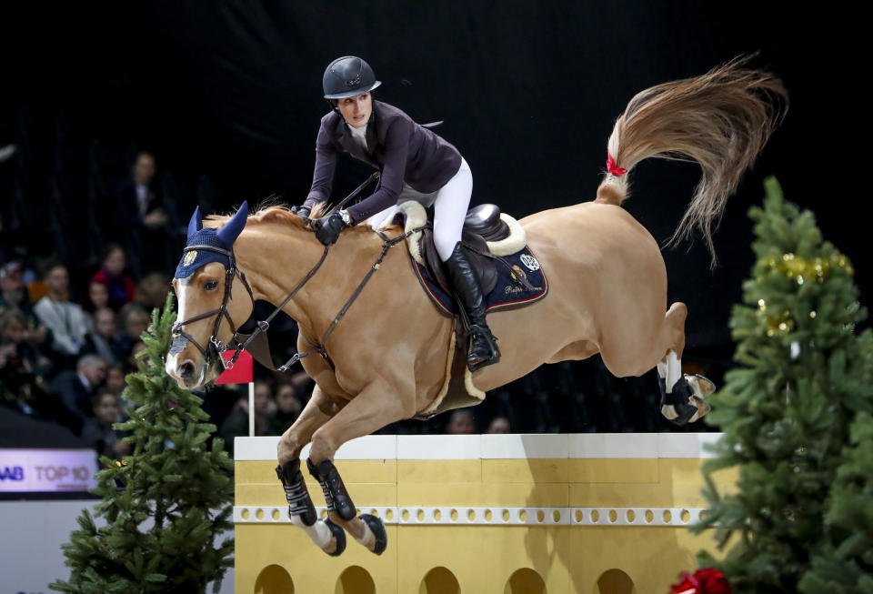 FILE - Jessica Springsteen rides Volage du Val Henry at the Sweden International Horse Show at the Friends Arena in Solna, Sweden, in this Sunday Dec. 1, 2019, file photo. The daughter of rock icon Bruce Springsteen and singer-songwriter Patti Scialfa has been selected as one of four riders on the U.S. jumping team that will compete at the Tokyo Olympics. Twenty-nine-year-old Jessica Springsteen is making her Olympic debut. (Christine Olsson/TT via AP, File)