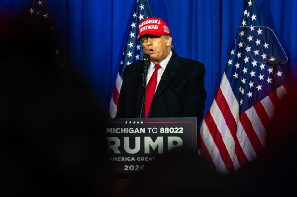Donald Trump speaks to supporters in Michigan on 17 February, one day after a New York judge delivered a financially crushing verdict against him after a sprawling civil fraud case (EPA)