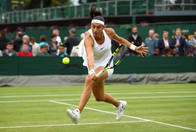 <p>Caroline Garcia of France plays a backhand during the Ladies Singles second round match against Katerina Siniakova of The Czech Republic on day four of the Wimbledon Lawn Tennis Championships at the All England Lawn Tennis and Croquet Club on June 30, 2016 in London, England. (Photo by Clive Brunskill/Getty Images)</p>