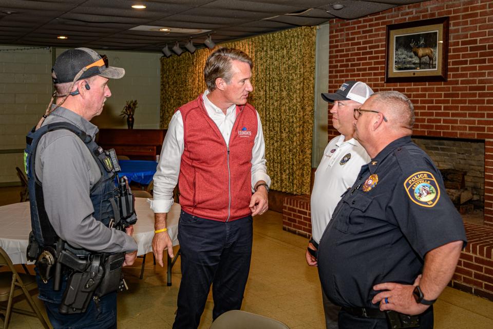 Republican candidate Glenn Youngkin speaks with members of Eastville Police Department.