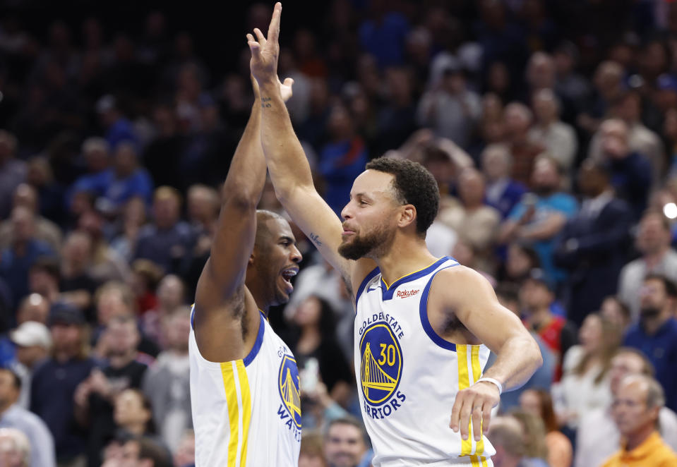 Nov 3, 2023; Oklahoma City, Oklahoma, USA; Golden State Warriors guard Stephen Curry (30) and guard <a class="link " href="https://sports.yahoo.com/nba/players/3930" data-i13n="sec:content-canvas;subsec:anchor_text;elm:context_link" data-ylk="slk:Chris Paul;sec:content-canvas;subsec:anchor_text;elm:context_link;itc:0">Chris Paul</a> (3) high five after defeating the Oklahoma City Thunder at Paycom Center. Golden State won 141-139. Mandatory Credit: Alonzo Adams-USA TODAY Sports