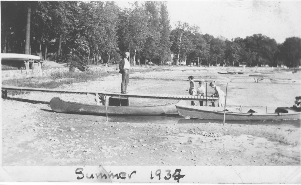 Members of the Davis family in 1934 look over the heavily receded shoreline at Devils Lake caused by a severe drought. The lack of rain that year stunted the crop season across Lenawee County, with farmers frustrated by promises of government aid for their losses.