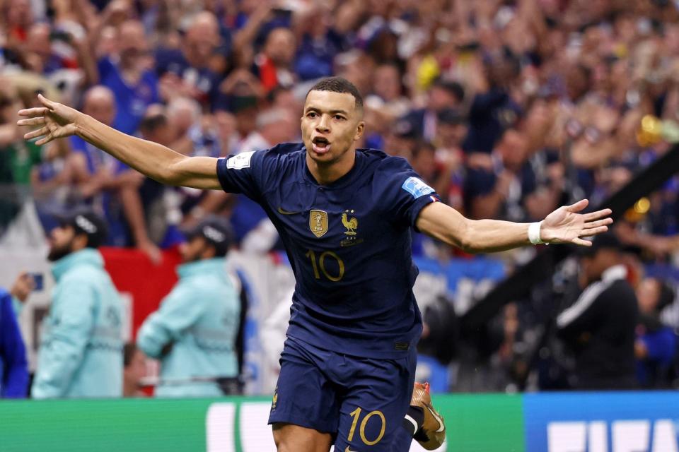 Dec 18, 2022; Lusail, Qatar; France forward Kylian Mbappe (10) celebrates after scoring a goal against Argentina on a penalty kick for his third goal of the match during extra time of the 2022 World Cup final at Lusail Stadium. Mandatory Credit: Yukihito Taguchi-USA TODAY Sports