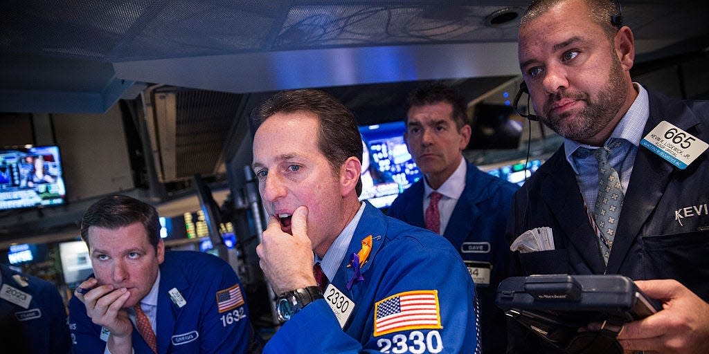 Traders work on the floor of the New York Stock Exchange