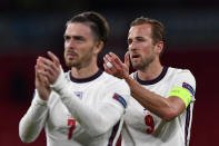 England's Harry Kane and Jack Grealish, left, applaud the supporters at the end of the Euro 2020 soccer championship group D match between the Czech Republic and England at Wembley stadium in London, Tuesday, June 22, 2021. England won 1-0. (Justin Tallis, Pool photo via AP)