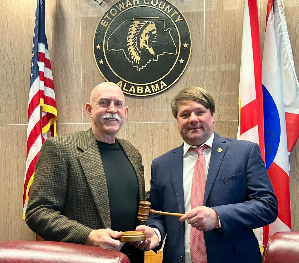 Incoming Etowah County Commission Chairman Tim Ramsey, left, receives the gavel from outgoing Chairman Craig Inzer Jr. on Jan. 2, 2024.