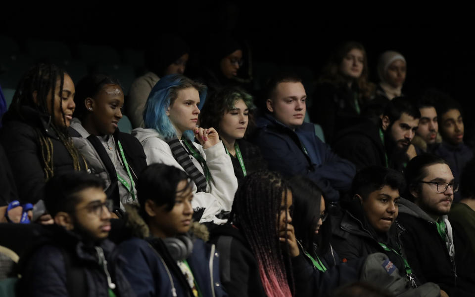 Students listen to politicians speaking during a Vote For Your Future Hustings at Westminster Kingsway College in London, Tuesday, Nov. 19, 2019. There is a generation of young people who weren't old enough to vote in the Brexit referendum, but in a British election dominated by the Brexit issue those young voters could hold the key to victory for which-ever party can garner their vote. (AP Photo/Kirsty Wigglesworth)