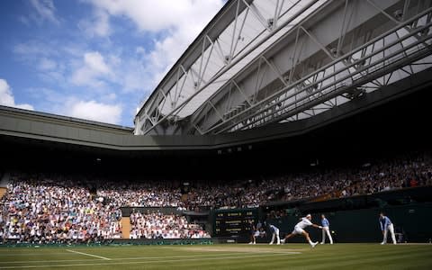 Roger Federer plays a return to Serbia's Novak Djokovic during the men's singles final match - Credit: POOL GETTY