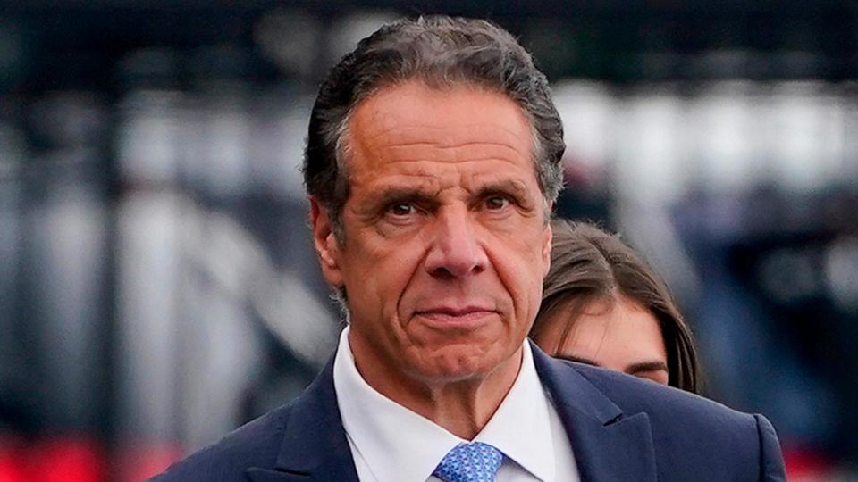 PHOTO: New York Gov. Andrew Cuomo prepares to board a helicopter after announcing his resignation, Aug. 10, 2021, in New York. (Seth Wenig/AP)