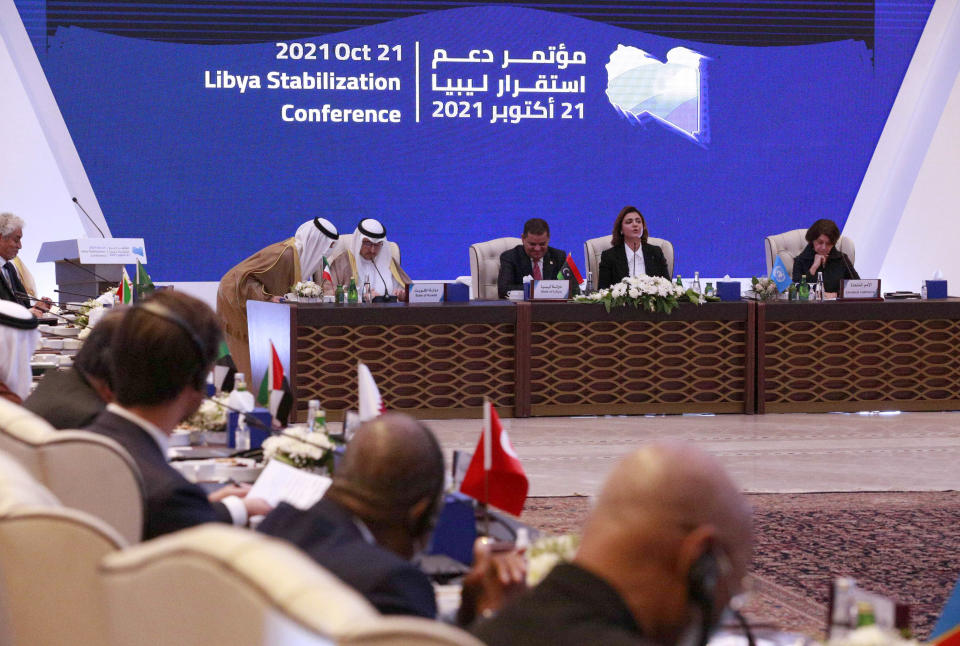 Libyan Prime Minister Abdul Hamid Dbeibah, center, hosts an international conference with western, regional and United Nations representatives aimed at resolving Libya's thorniest issues ahead of general elections planned for December, at the Coronthia Hotel in Tripoli, Libya, Thursday, Oct. 21, 2021. (AP Photo/Yousef Murad)