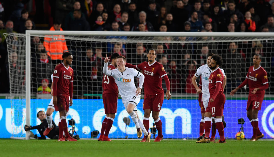 Alfie Mawson celebrates his goal against Liverpool. (Getty)