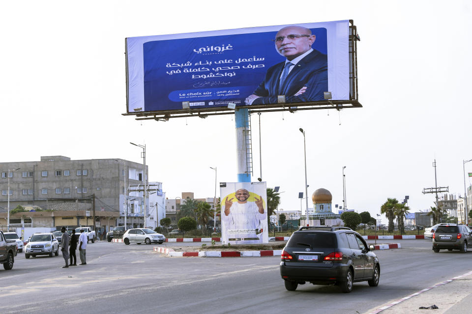 An electoral banner for Mauritanian president Mohamed Ould Ghazouani, is seen ahead of the presidential elections in Nouakchott, Mauritania, Tuesday, June 25, 2024. Banner in Arabic reads "I will work on building a complete sewage network in Nouakchott." (AP Photo/Mamsy Elkeihel)