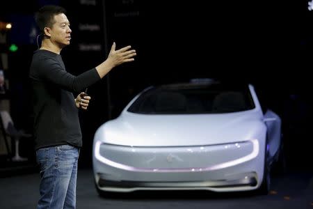 Jia Yueting, co-founder and head of Le Holdings Co Ltd, also known as LeEco and formerly as LeTV, gestures as he unveils an all-electric battery "concept" car called LeSEE during a ceremony in Beijing, China April 20, 2016. REUTERS/Damir Sagolj