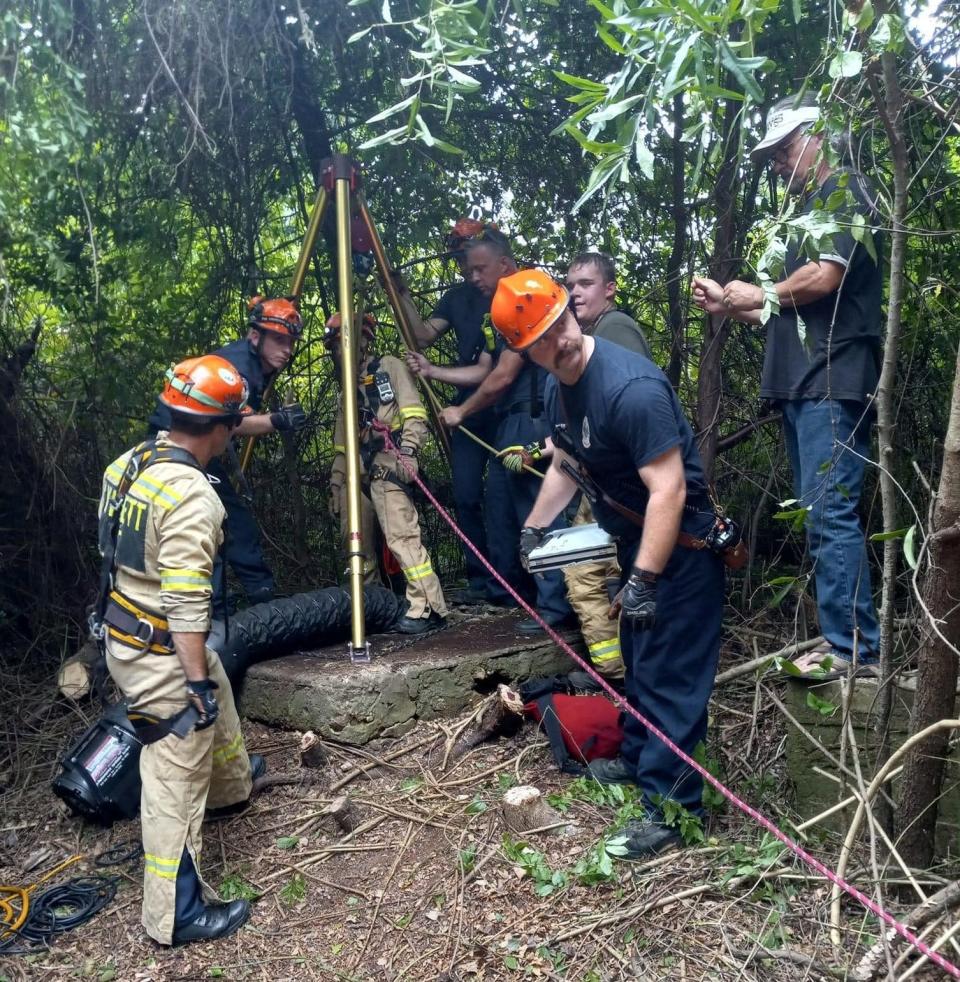 A rescue team from Gwinnett County worked to rescue a dog that fell 35 feet into an abandoned well in Oconee County.