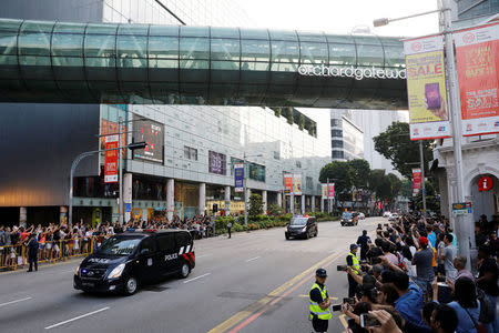 Police vehicles escort as the motorcade of North Korean leader Kim Jong Un makes its way to the Istana in Singapore June 10, 2018. REUTERS/Tyrone Siu