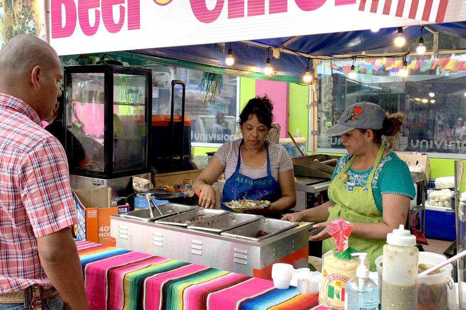 For many, the annual Fiesta brings needed income. This year many workers are happy to see crowds turning out even if they are not as large. (Suzanne Gamboa / NBC News)