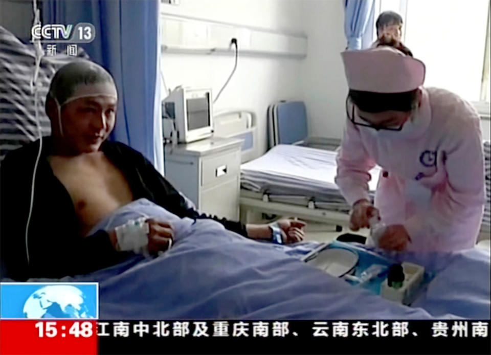 <p>Video still of Qiao Dashuai, left, is attended to by nurses at a hospital after surviving a landslide in Xinmo village in Maoxian County in southwestern China’s Sichuan Province, Saturday, June 24, 2017. (Photo: CCTV via AP Video) </p>