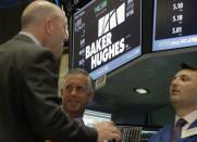 Traders work at the post where Baker Hughes is traded on the floor of the New York Stock Exchange (NYSE) in New York City, U.S., May 2, 2016. REUTERS/Brendan McDermid