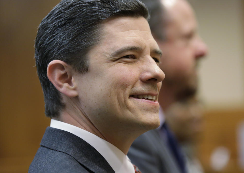 Brett Busby, appointed by Texas Gov. Greg Abbott to fill a vacancy on the Texas Supreme Court, attends his Senate confirmation hearing, Thursday, March 7, 2019, in Austin, Texas. Barely three months after Texas Democrats showed signs of cracking Republican dominance in Texas elections, Abbott is using the power of his office to stem that tide by appointing Republican judges who had been rejected by voters to new positions on the bench. (AP Photo/Eric Gay)