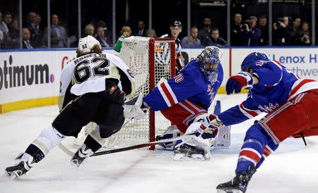 New York Rangers goalie Henrik Lundqvist (30) keeps his eyes on Pittsburgh Penguins left wing Carl Hagelin (62) during the first period in game four of the first round of the 2016 Stanley Cup Playoffs at Madison Square Garden. Mandatory Credit: Adam Hunger-USA TODAY Sports