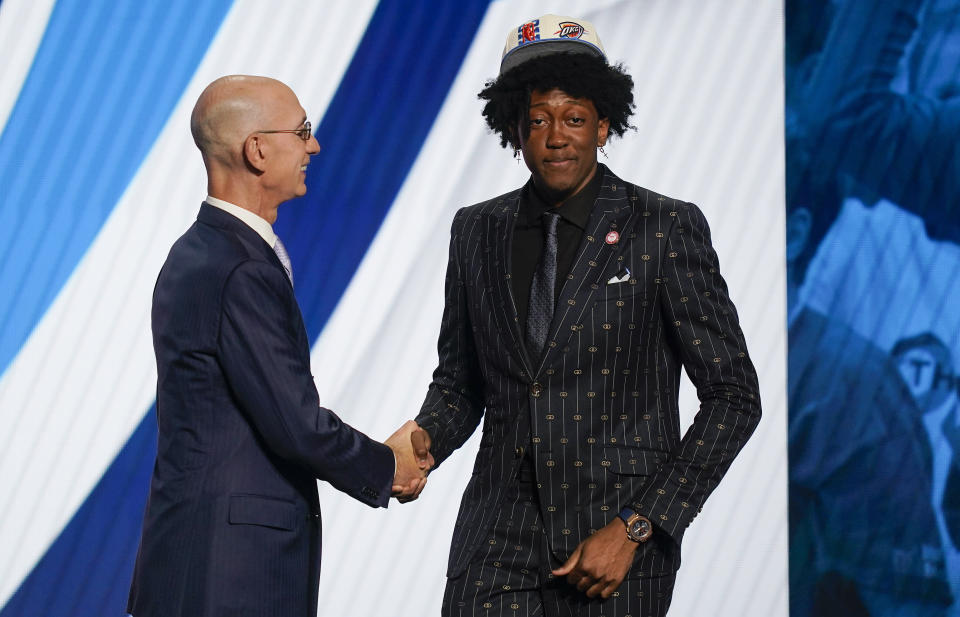 Jalen Williams is congratulated by NBA Commissioner Adam Silver after being selected 12th overall by the Oklahoma City Thunder in the NBA basketball draft, Thursday, June 23, 2022, in New York. (AP Photo/John Minchillo)