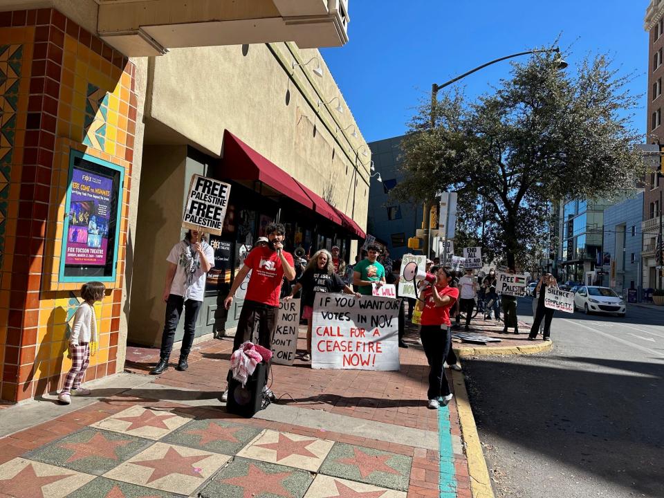 Protestors gather outside the Fox Theatre in Tucson following Jill Biden's speech there.