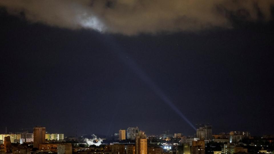 PHOTO: Ukrainian servicemen use a searchlight as they search for drones in the sky over the city during a Russian drone and missile strike, amid Russia's attack on Ukraine, in Kyiv, Ukraine, on May 8, 2024. (Gleb Garanich/Reuters)
