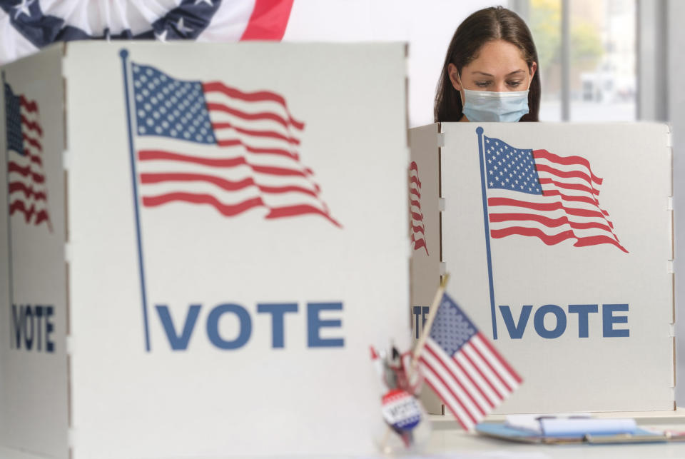 a person at the voting booth