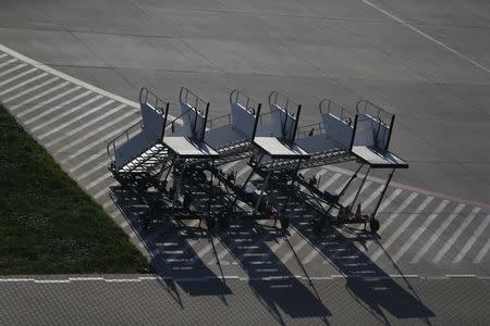 Passenger stairs are seen in front of the airport in Lodz October 10, 2014. REUTERS/Kacper Pempel