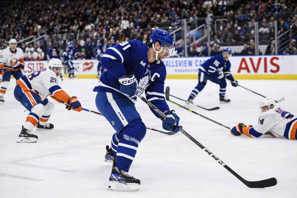 Toronto Maple Leafs center John Tavares (91) attacks the net during second period of an NHL hockey game against the New York Islanders in Toronto, Monday, Nov. 21, 2022. (Christopher Katsarov/The Canadian Press via AP)