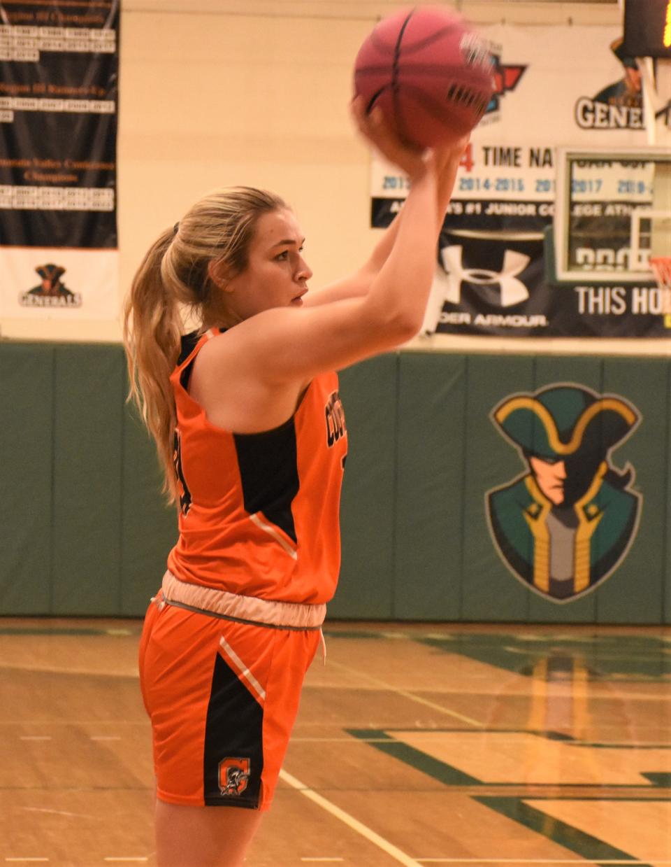 Cooprstown's Dani Seamon puts up a shot against Mt. Markham Sunday during the Utica Board of Officials for Women's Basketball Cancer Challenge at Herkimer College.