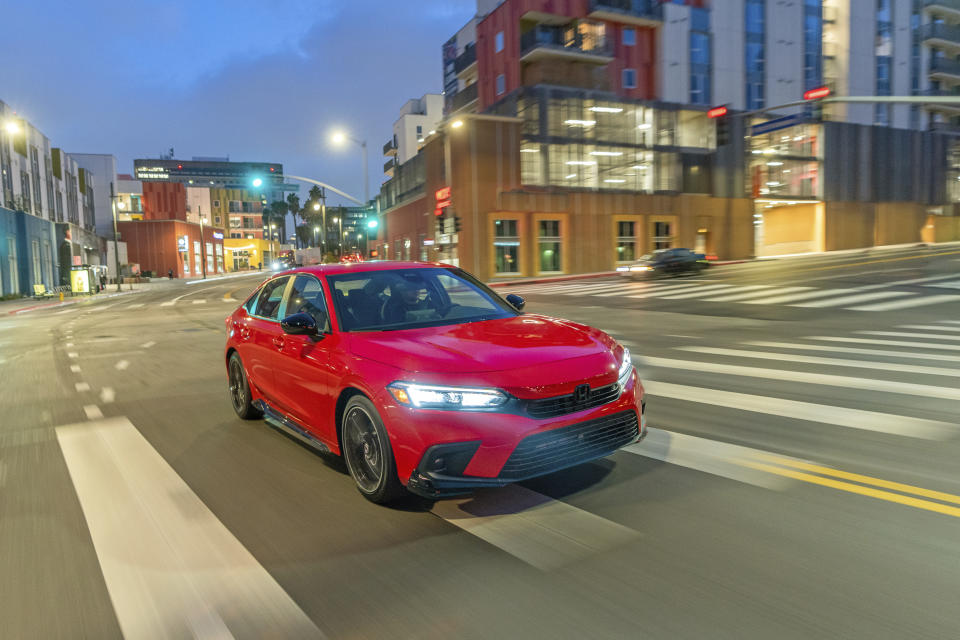 This undated photo provided by Honda shows the 2022 Honda Civic, which is the Edmunds Top Rated Sedan. It has more subdued styling in its current 11th generation and offers an exceptionally quiet cabin alongside a rich set of features. (Courtesy of American Honda Motor Co. via AP)