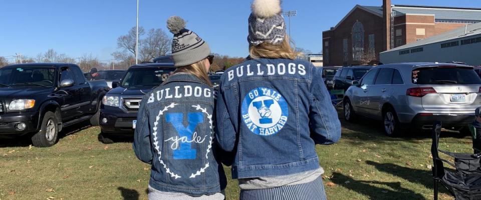 Ivy League students wearing their Yale jean jackets designed by them at the football game tailgate