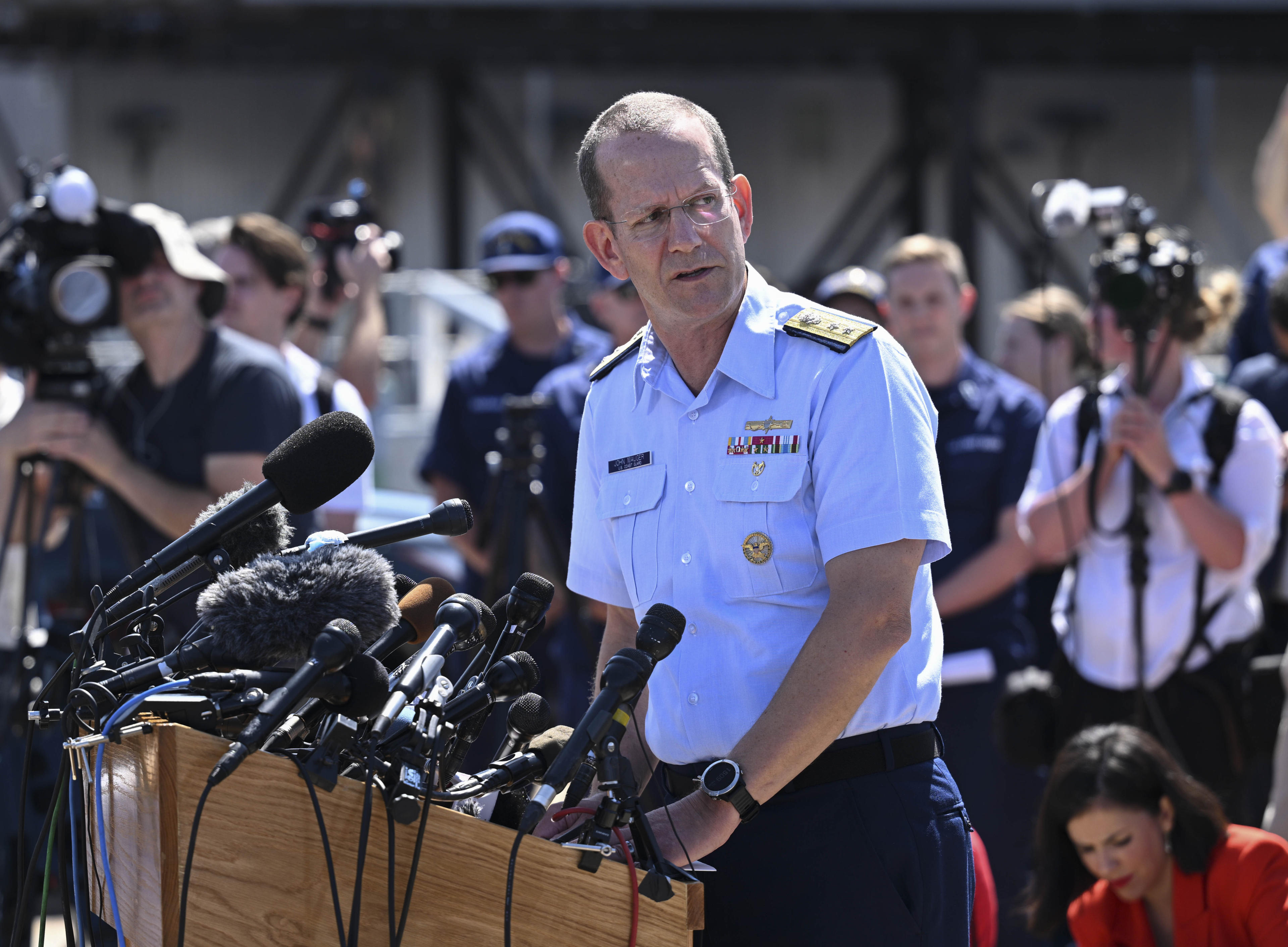 Rear Adm. John Mauger, the First Coast Guard District commander, in a press conference, said debris discovered on the ocean floor suggested that the missing submersible near the wreck of the Titanic suffered a 