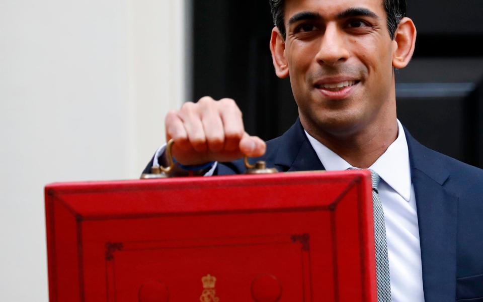 Britain's Chancellor of the Exchequer Rishi Sunak poses for pictures with the Budget Box - TOLGA AKMEN/AFP