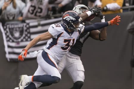 FILE PHOTO: Nov 26, 2017; Oakland, CA, USA; Oakland Raiders tight end Jared Cook (87) catches a pass for a touchdown against Denver Broncos strong safety Justin Simmons (31) during the second quarter but overruled in a review for not having control of the football at Oakland Coliseum. Neville E. Guard-USA TODAY Sports